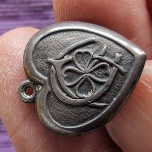 Antique sterling silver puffed heart charm